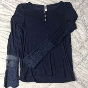 Navy blue top with lace sleeves. Small